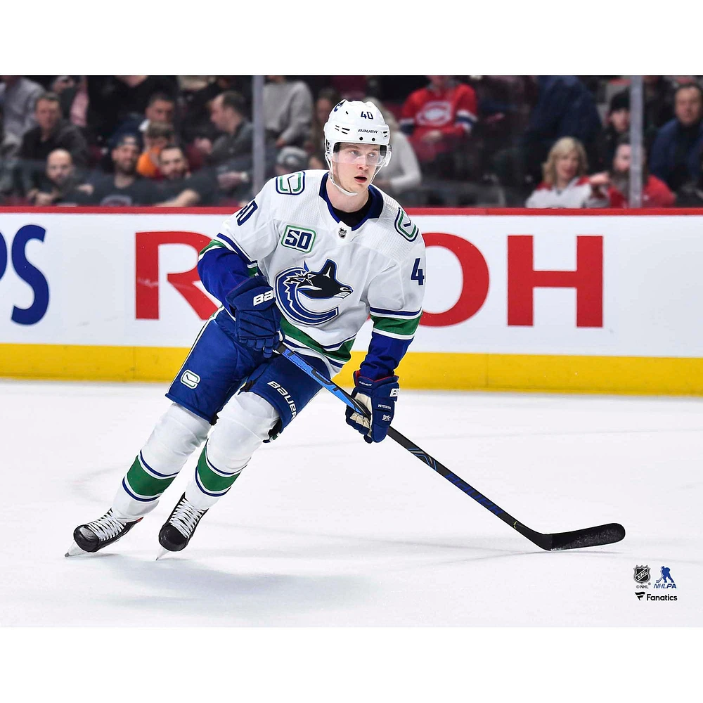 Elias Pettersson Vancouver Canucks Unsigned White Jersey Skating Photograph