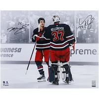 Connor Hellebuyck & Mark Scheifele Winnipeg Jets Autographed 16" x 20" Navy Alternate Jersey Celebration Spotlight Photograph
