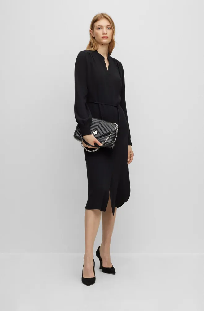 Belted dress with collarless V neckline and button cuffs