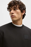 Sweatshirt with drop-needle stitching