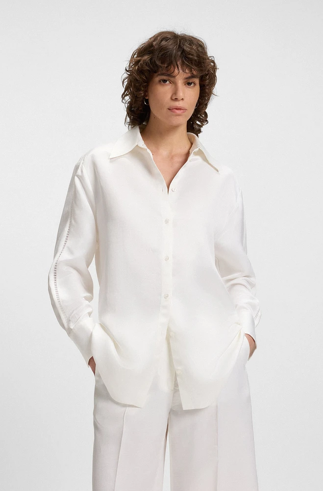 Tailored blouse with crochet-effect trims