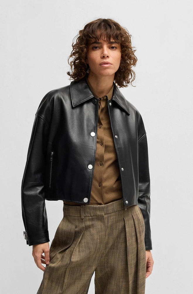 Leather jacket with covered press studs