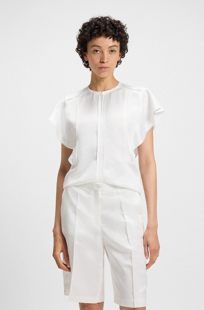 Frill-sleeve blouse with crochet-style trims