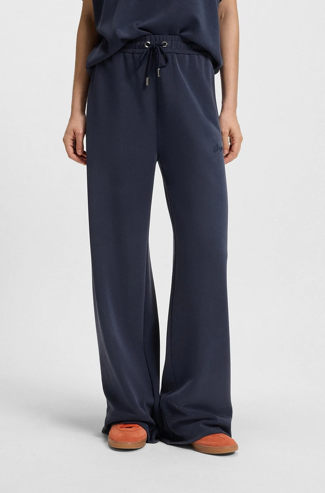 Relaxed-fit tracksuit bottoms with embroidered logo