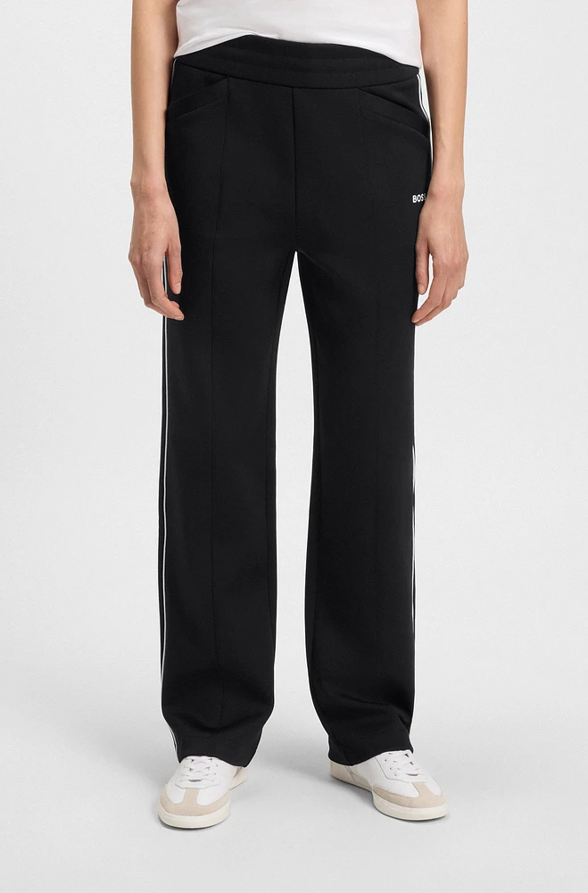 Straight-fit tracksuit bottoms with contrast logo and piping