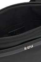 Reporter bag with smooth and structured finishes
