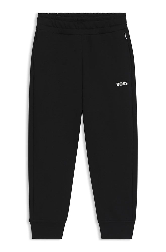 Kids' tracksuit bottoms with logo print