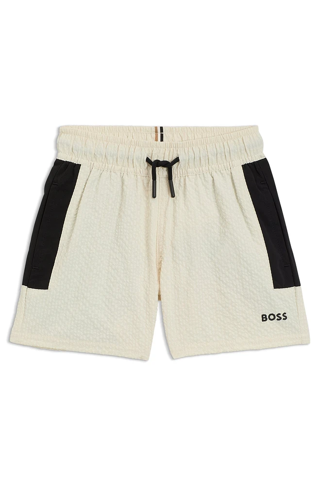 Kids' swim shorts seersucker fabric with logo print