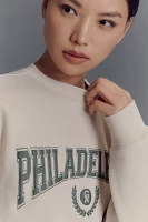 Good American x Anthropologie Philadelphia Graphic Crew-Neck Sweatshirt