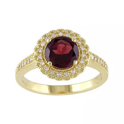 Genuine Garnet and 1/7 CT. T.W. Diamond Ring