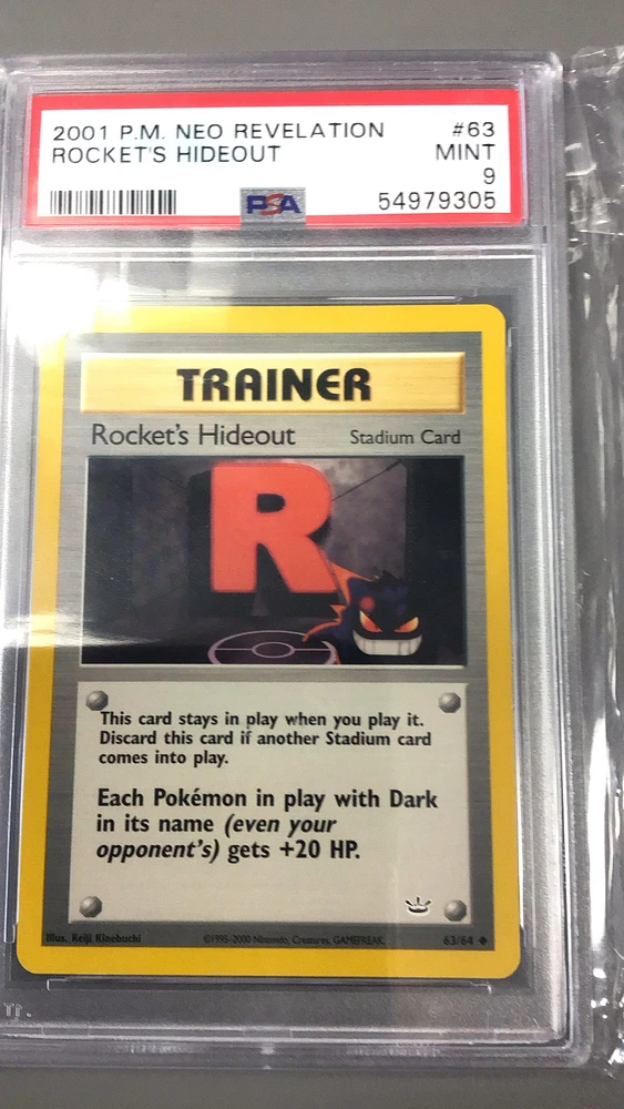 2001 Pokemon Neo Revelation 63 Rocket's Hideout PSA 9