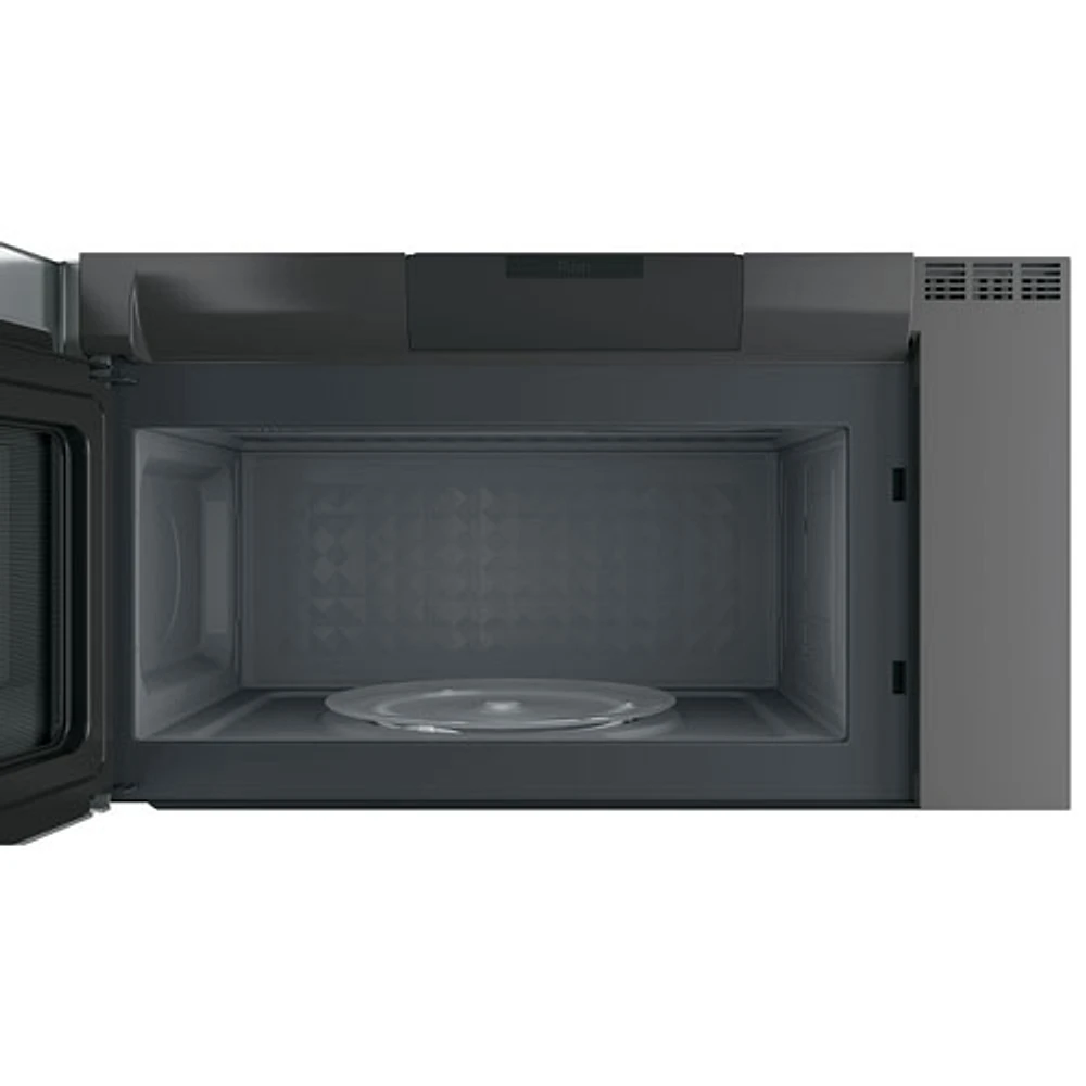 Four à micro-ondes à hotte intégrée SpaceMaker Profile de GE - 2,1 pi3 - Acier inoxydable