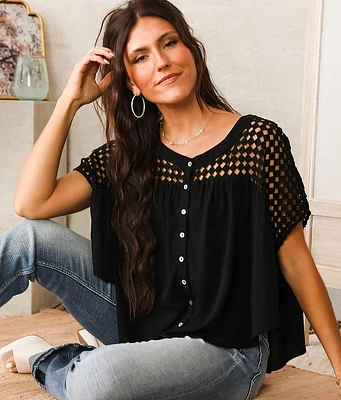 A. Peach Pieced Crochet Blouse