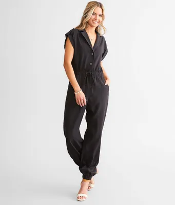A. Peach Solid Boiler Jumpsuit