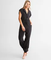 A. Peach Solid Boiler Jumpsuit