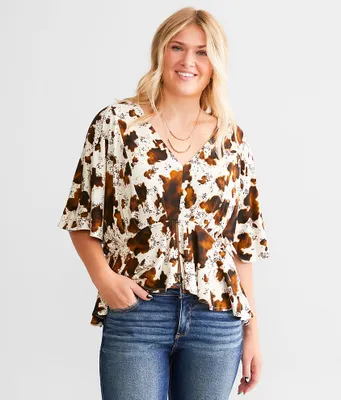 Daytrip Cow Print Split Peplum Top