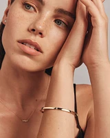 Diamond Accent Oval Bangle in 10kt Yellow Gold