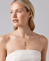 0.17 Carat TW Diamond Knot Pendant in 10kt Yellow Gold