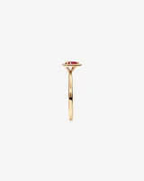 Pear Cut Red Ruby Gemstone and 0.08 Carat TW Diamond Halo Ring in 10kt Yellow Gold