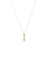 0.17 Carat TW Diamond Knot Pendant in 10kt Yellow Gold