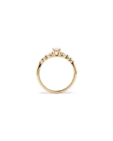 0.59 Carat TW Oval and Pear Sidestone Engagement Ring in 14kt Yellow Gold
