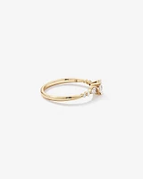 0.59 Carat TW Oval and Pear Sidestone Engagement Ring in 14kt Yellow Gold