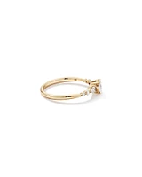 0.59 Carat TW Oval and Pear Sidestone Engagement Ring in 14kt Yellow Gold