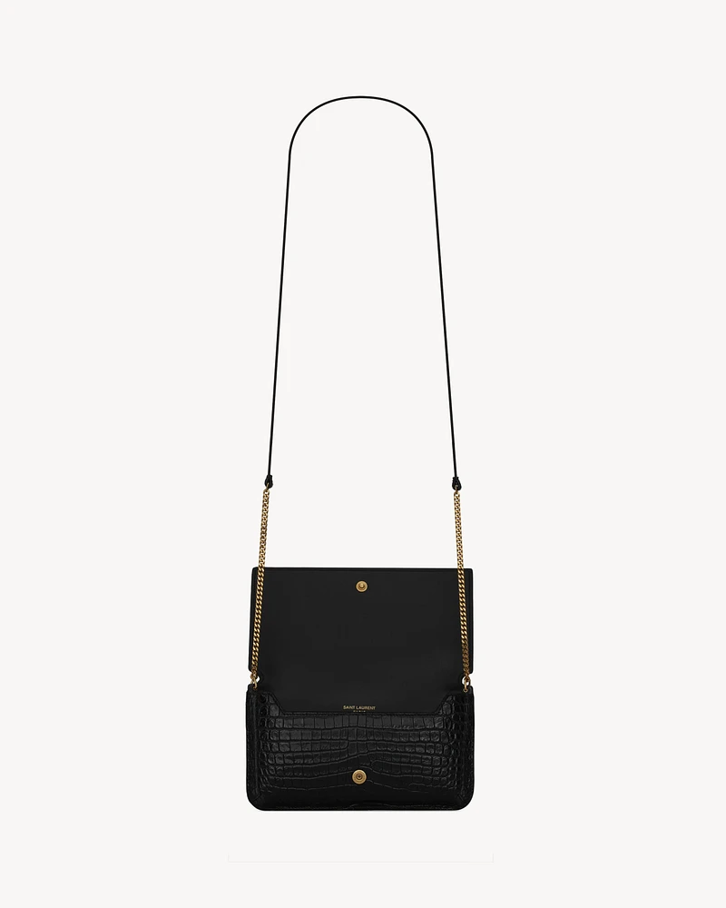 CASSANDRE phone holder in SHINY crocodile-embossed leather
