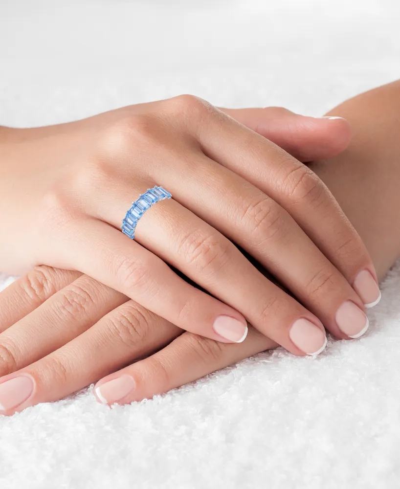 Created Light Blue Spinel Emerald Cut Eternity Band Rhodium Plated Sterling Silver