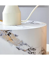 The cylindrical table with its patterned design can be easily integrated into a variety of interior styles, from coffee tables to small dining tables