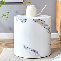 The cylindrical table with its patterned design can be easily integrated into a variety of interior styles, from coffee tables to small dining tables
