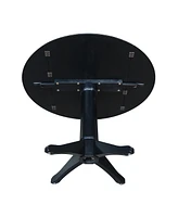 International Concept 42" Round Dual Drop Leaf Pedestal Table