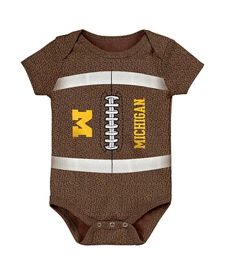Newborn and Infant Boys Girls Brown Michigan Wolverines Catch Me Football Bodysuit