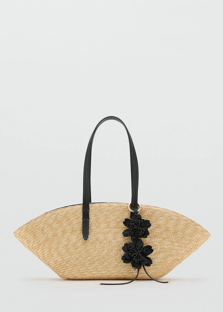 Natural fiber basket with flower charm