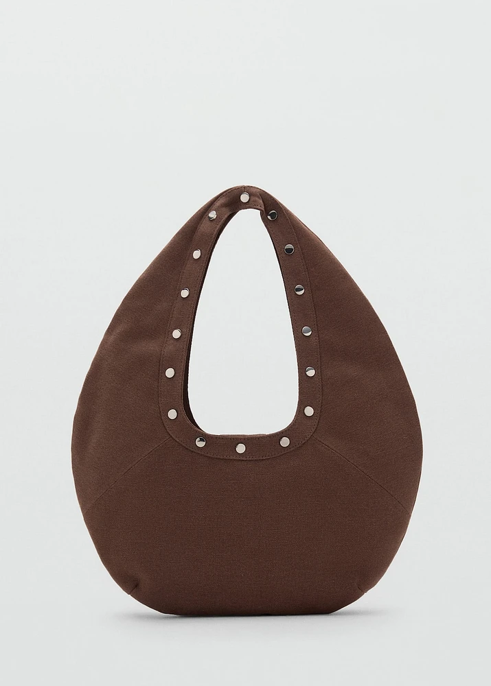 Oval studded shoulder bag