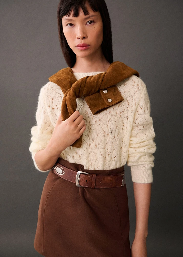 Knitted sweater with openwork details