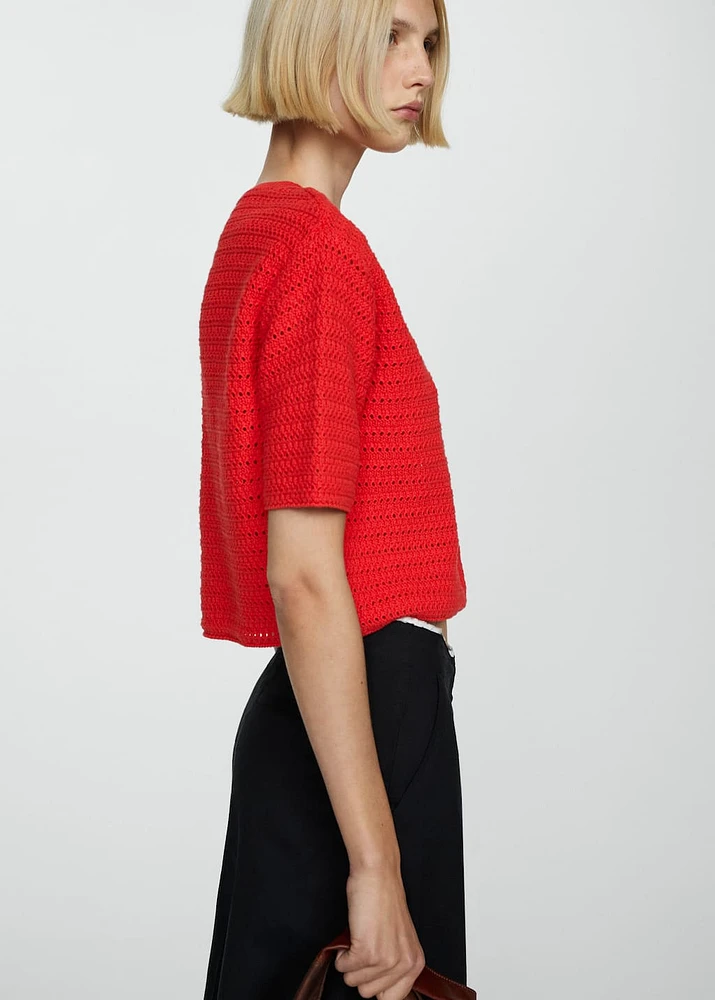 Knitted sweater with openwork details