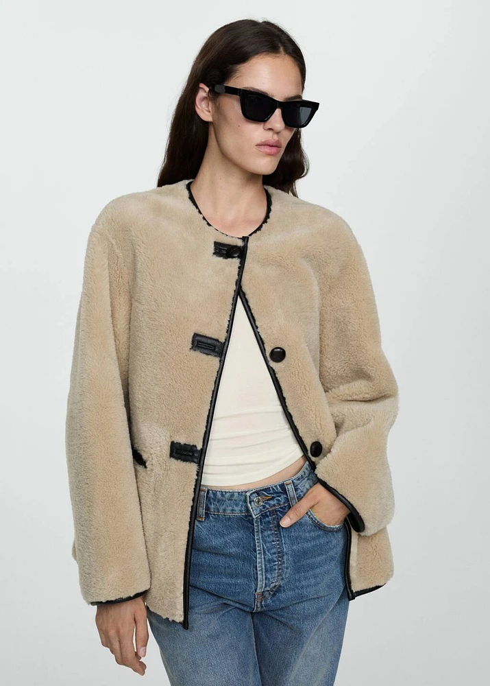 Fur-effect coat with appliqués