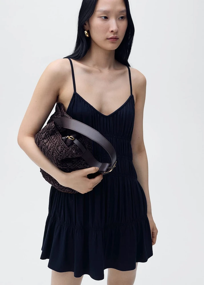 Short dress with gathered panels