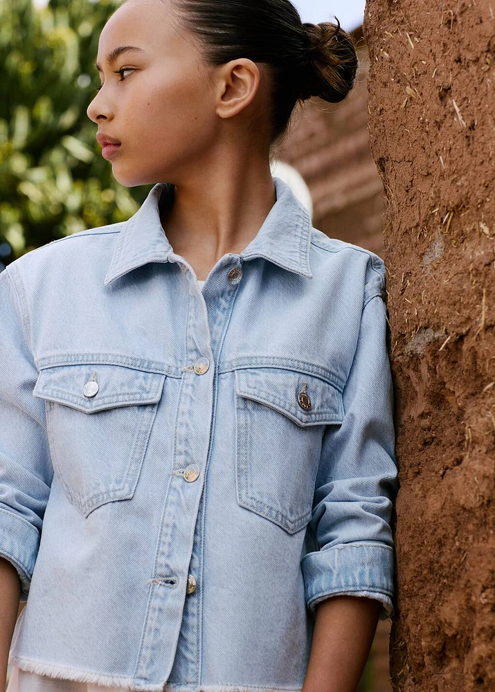 Denim jacket with frayed hem