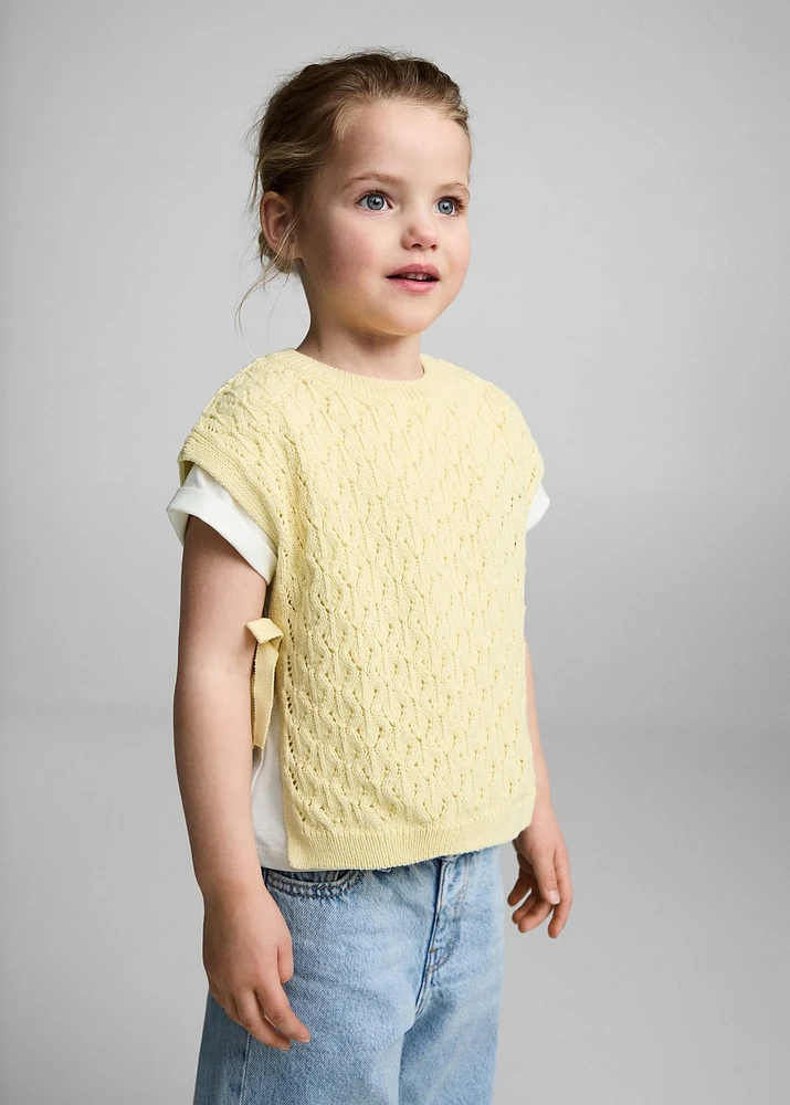 Knitted vest with openwork details
