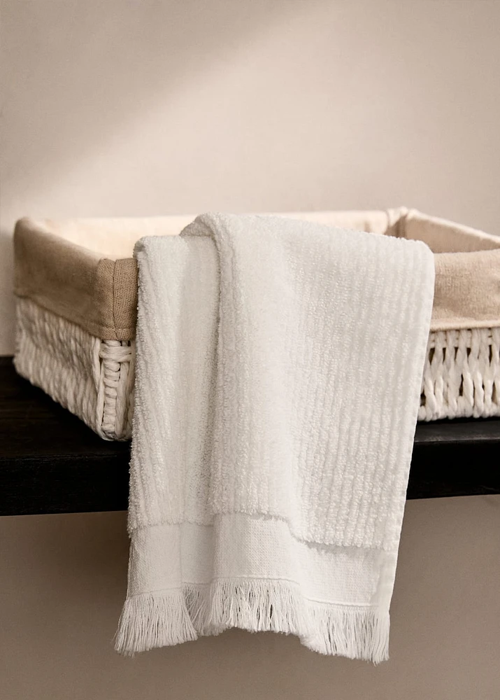 Stripe-embossed washbasin towel with fringes