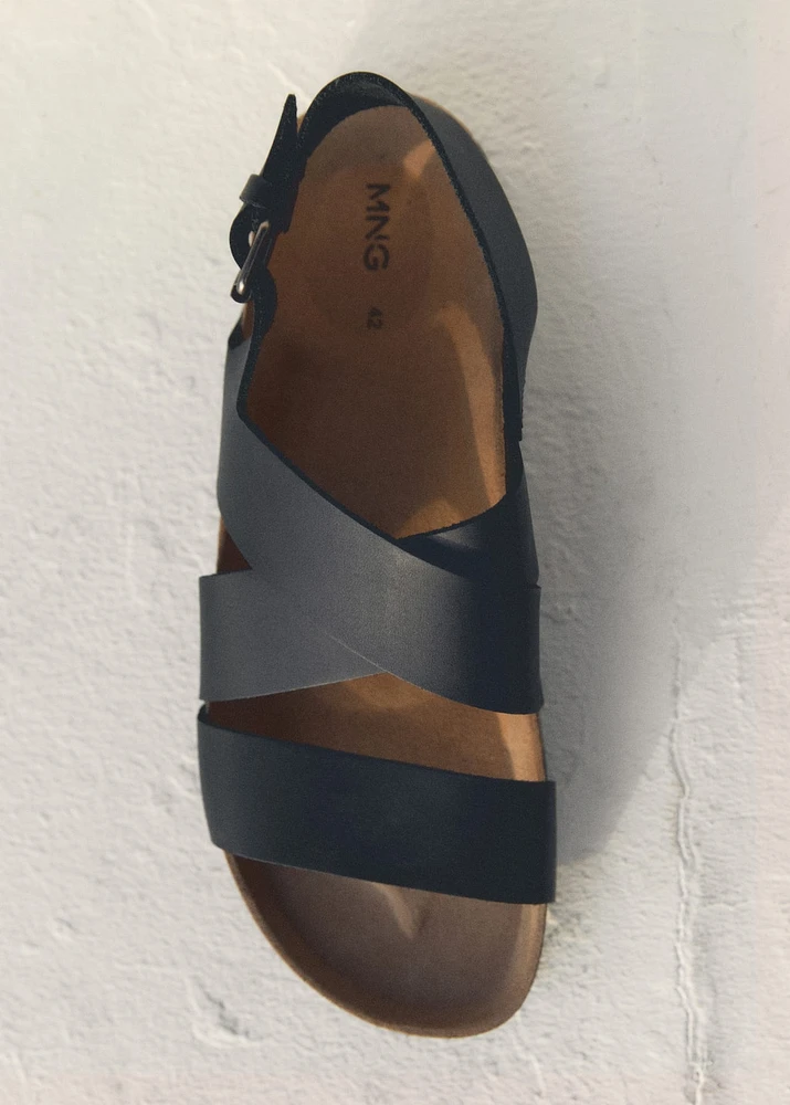 Crossed leather sandals with buckle