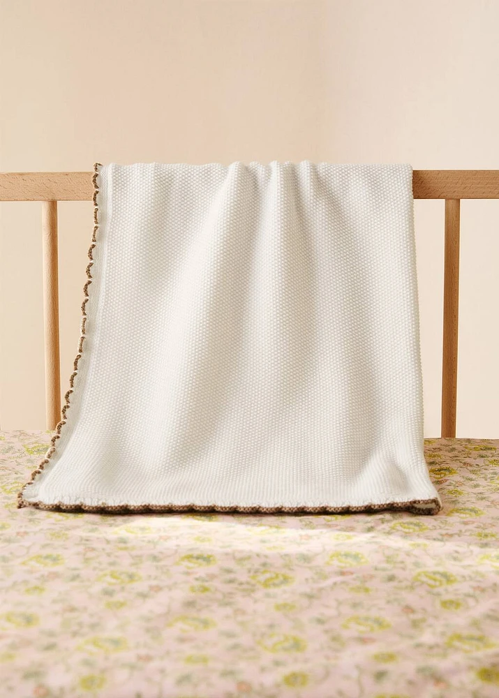 Cotton knitted children's blanket with crochet trim