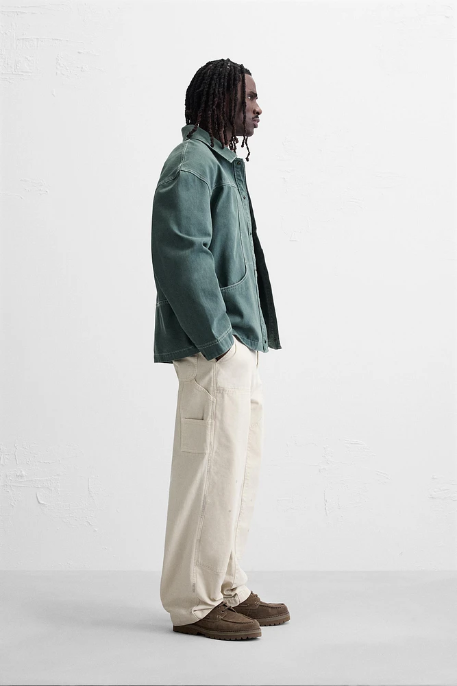 VESTE DÉLAVÉE SURPIQÛRES CONTRASTÉES