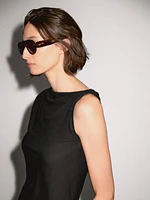 Asymmetric top with knot detail