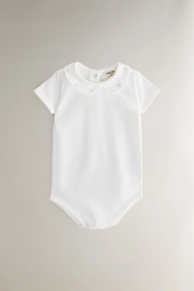 CHILDREN'S BODYSUIT WITH FLORAL EMBROIDERY