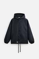 BLOUSON TECHNIQUE À CAPUCHE