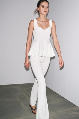 PEPLUM STRETCH TOP