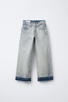 SEAMLESS HEM FLARED JEANS